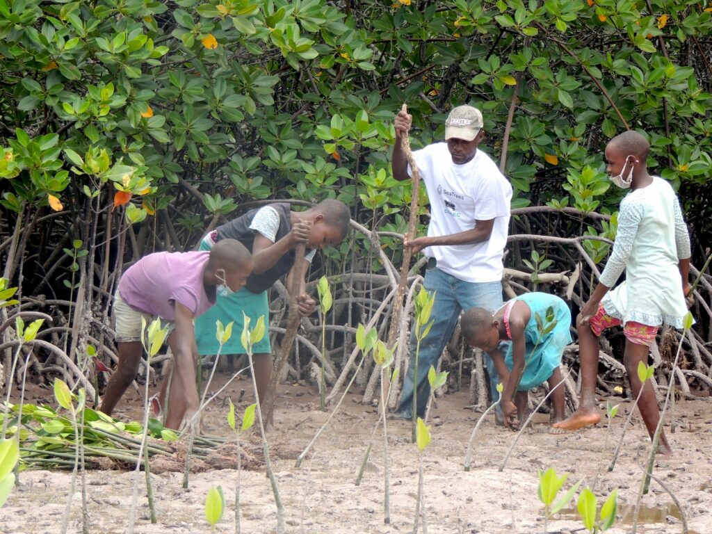 African Family working in field during a planting event